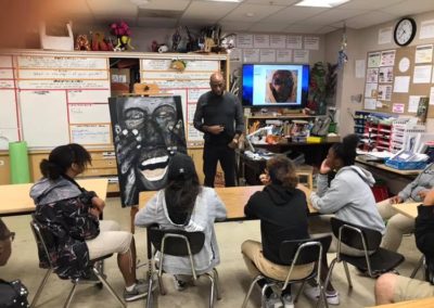 Lyle Rushing addressing formal issues in his self portrait painting (on the easel).